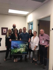 SCR Members presenting a photo to The Department of Environmental Protection
