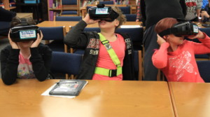 Children Looking Around through Virtual Reality Tour using Iphone